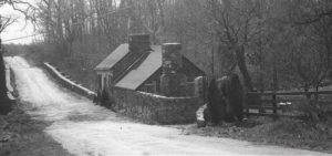 On the south side of Route 7, the Broad Run Tollhouse, seen in a photo from 1953, was a favorite place for selling moonshine as drivers had to stop there to pay tolls until 1924. Photo Credit: Muriel Spetzman