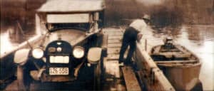 Ferryman Charles Ashby Williams checks the engine in this early 1900s photo at Whites Ferry